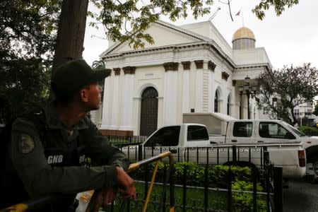 A Venezuelan National Guard stands guard outside the National Assembly building during a parliamentary session in Caracas, Venezuela December 14, 2016. REUTERS/Marco Bello