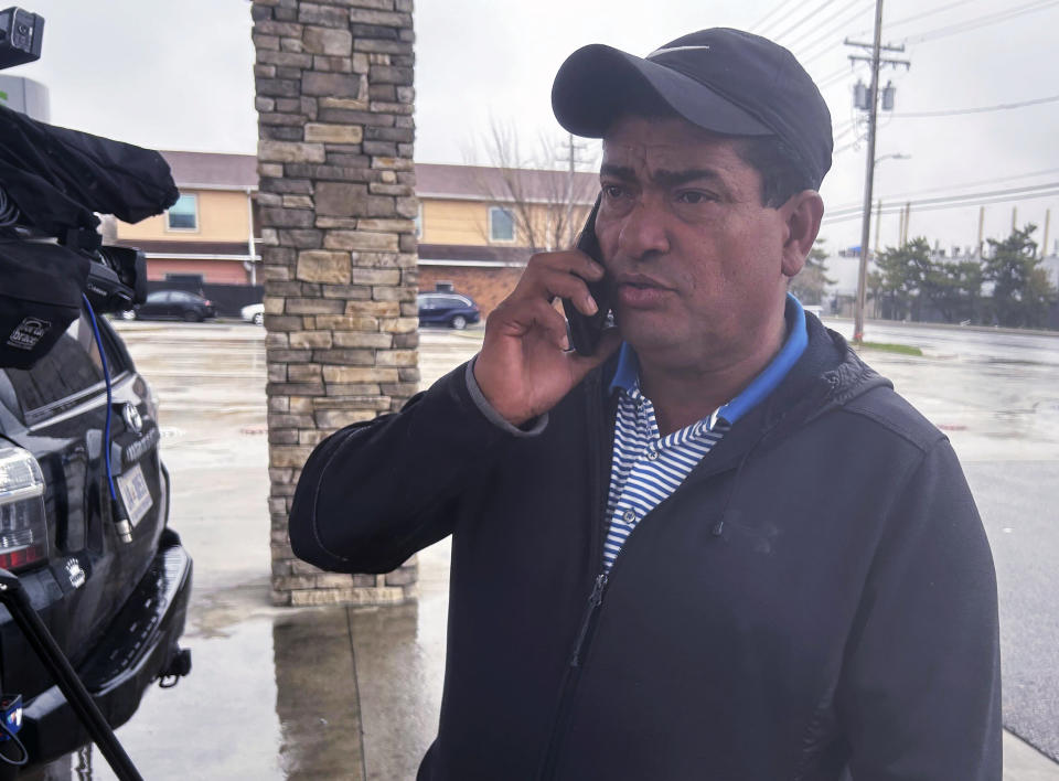 Carlos Suazo Sandoval speaks with a reporter on the phone, Wednesday, March 27, 2024 in Dundalk, Md. One of the construction workers presumed dead in Baltimore was a 38-year-old father and Sandoval's younger brother, Maynor Yassir Suazo Sandoval, who had been in the United States for 18 years but “always dreamed of, in his old age, retiring peacefully in Honduras.” (AP Photo/Brian Witte)