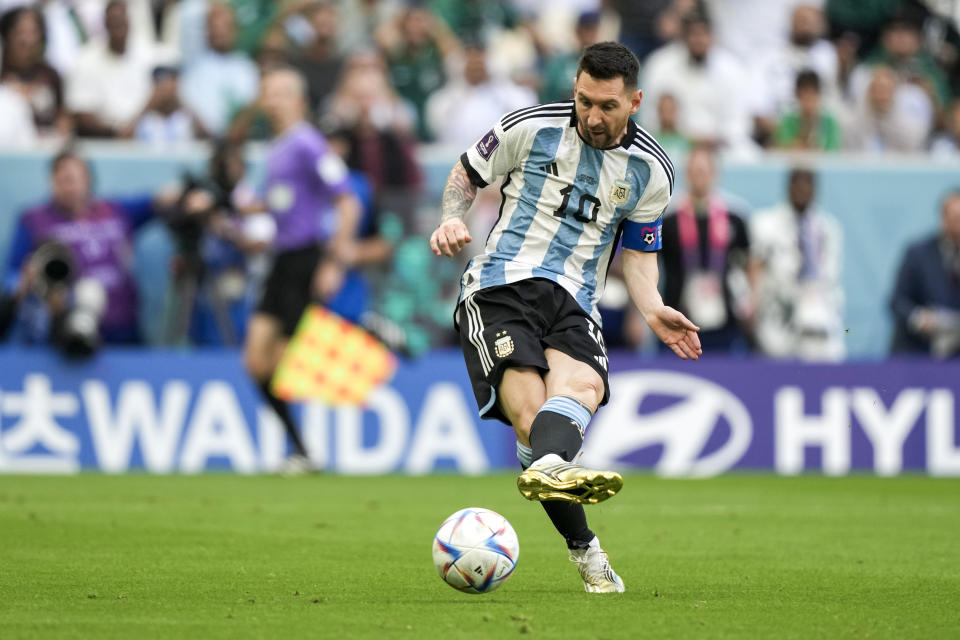 Argentina's Lionel Messi kicks the ball during the World Cup group C soccer match between Argentina and Saudi Arabia at the Lusail Stadium in Lusail, Qatar, Tuesday, Nov. 22, 2022. (AP Photo/Jorge Saenz)