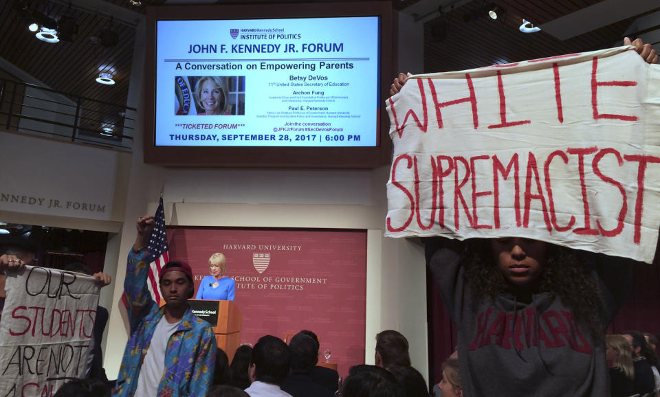 Protesters demonstrate during a speech by Education Secretary Betsy DeVos at Harvard University's Kennedy School of Government on Sept. 28, 2017. Asked about protections for transgender students, DeVos said she was committed to making sure all students are safe. But she rescinded guidance that allowed transgender students to use bathrooms that matched their gender identity. (Photo: Maria Danilova/AP)