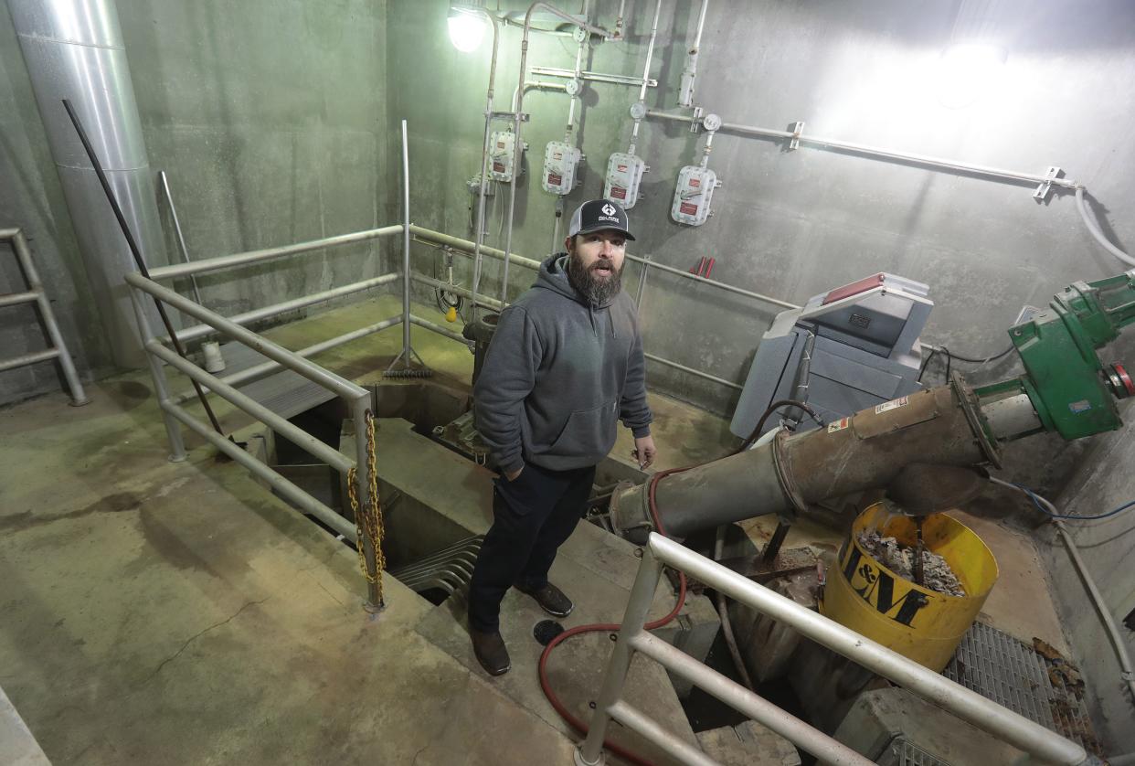 Dustin J. Taylor, superintendent of Navarre's wastewater treatment plant, discusses the updates needed at the plant, which was constructed in the 1930s, in this file photo from 2022.