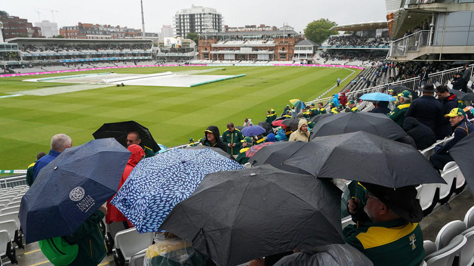 Spectators stuck around but didn't see any action. (Photo by Jed Leicester/Getty Images)