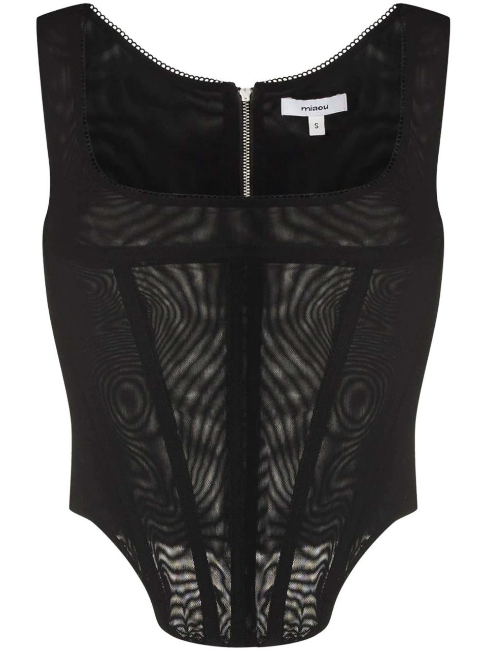 <p>285€</p><br><a href="https://www.farfetch.com/fr/shopping/women/miaou-haut-corset-campbell-item-17356853.aspx?rtype=stl_manual&rmodule=shop_the_look&rid=8478846&rpos=4&rorank=stl_manual&lpos=1" rel="nofollow noopener" target="_blank" data-ylk="slk:Acheter;elm:context_link;itc:0;sec:content-canvas" class="link ">Acheter</a>