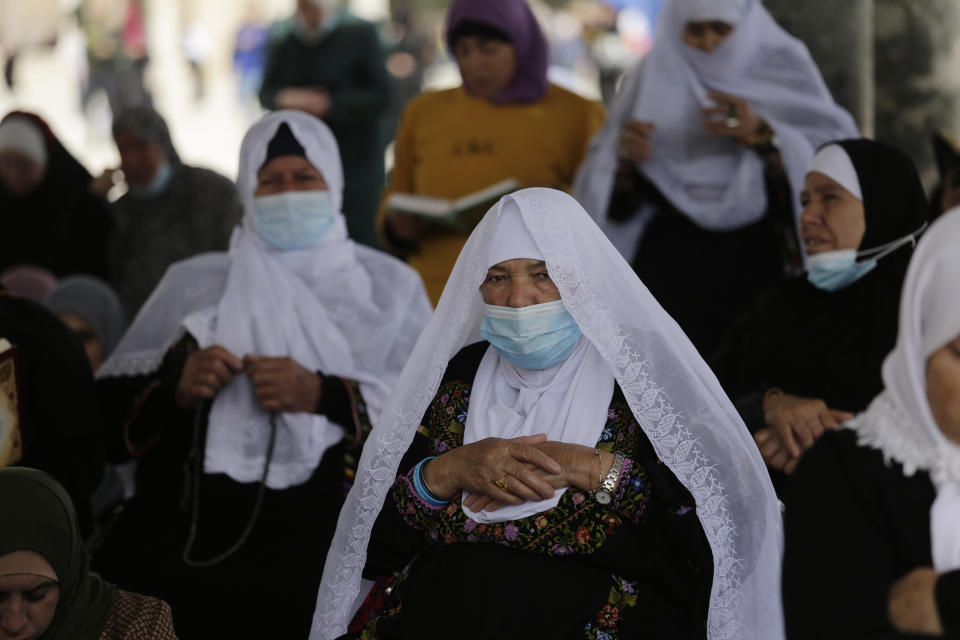 Palestinian women take part in the last Friday prayers of the Muslim holy month of Ramadan at the Dome of the Rock Mosque in the Al Aqsa Mosque compound in the Old City of Jerusalem, Jerusalem, Friday, May 7, 2021. (AP Photo/Mahmoud Illean)