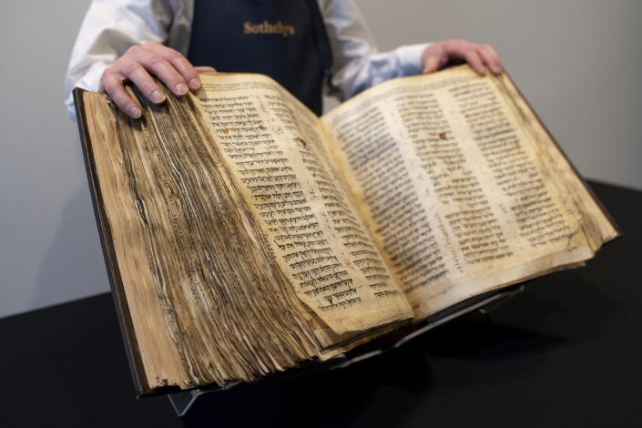 FILE - Sotheby's unveils the Codex Sassoon for auction, Wednesday, Feb. 15, 2023, in the Manhattan borough of New York. The 1,100-year-old Hebrew Bible that is one of the oldest surviving biblical manuscripts sold for $38.1 million, which includes the auction house's fee, Wednesday, May 17, 2023, in New York. (AP Photo/John Minchillo, File)