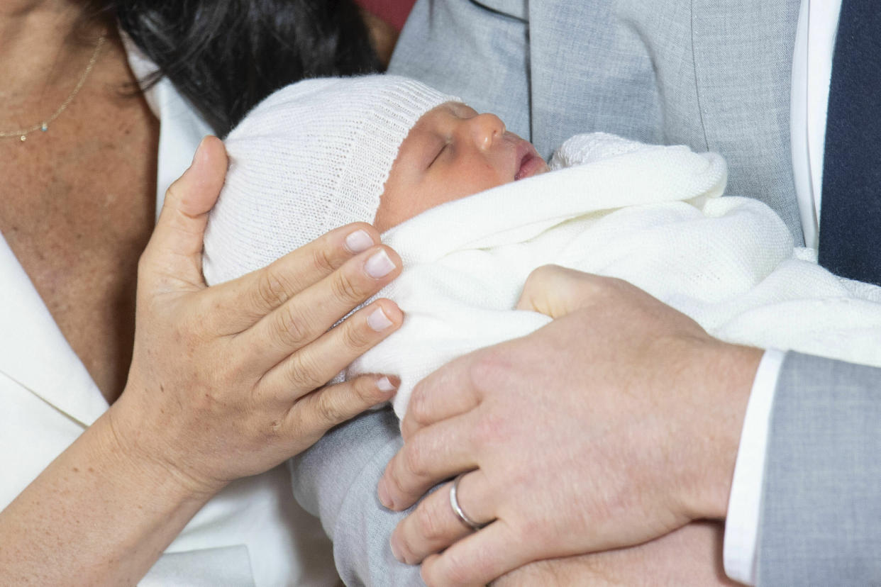 Britain's Prince Harry and Meghan, Duchess of Sussex, during a photocall with their newborn son, in St George's Hall at Windsor Castle, Windsor, south England, Wednesday May 8, 2019. Baby Sussex was born Monday at 5:26 a.m. (0426 GMT; 12:26 a.m. EDT) at an as-yet-undisclosed location. An overjoyed Harry said he and Meghan are "thinking" about names. (Dominic Lipinski/Pool via AP)