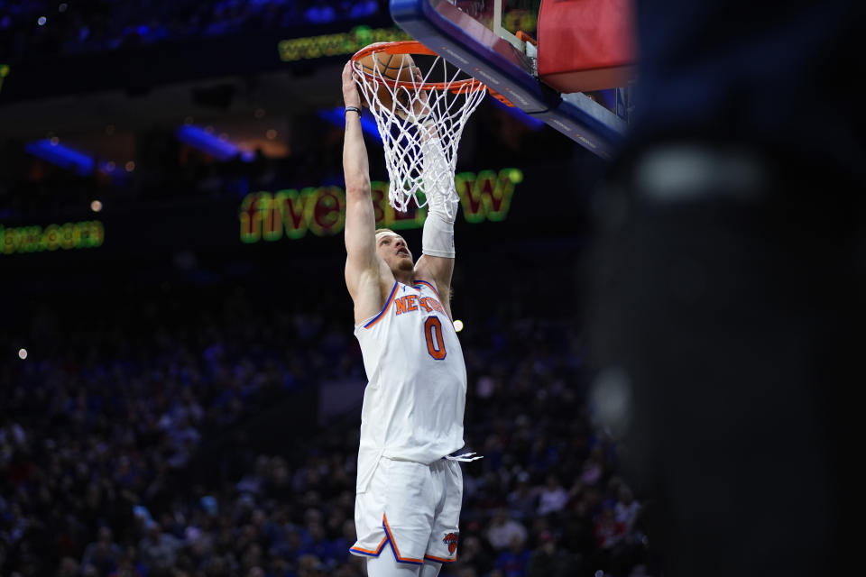New York Knicks' Donte DiVincenzo dunks during the first half of an NBA basketball game against the Philadelphia 76ers, Thursday, Feb. 22, 2024, in Philadelphia. (AP Photo/Matt Slocum)