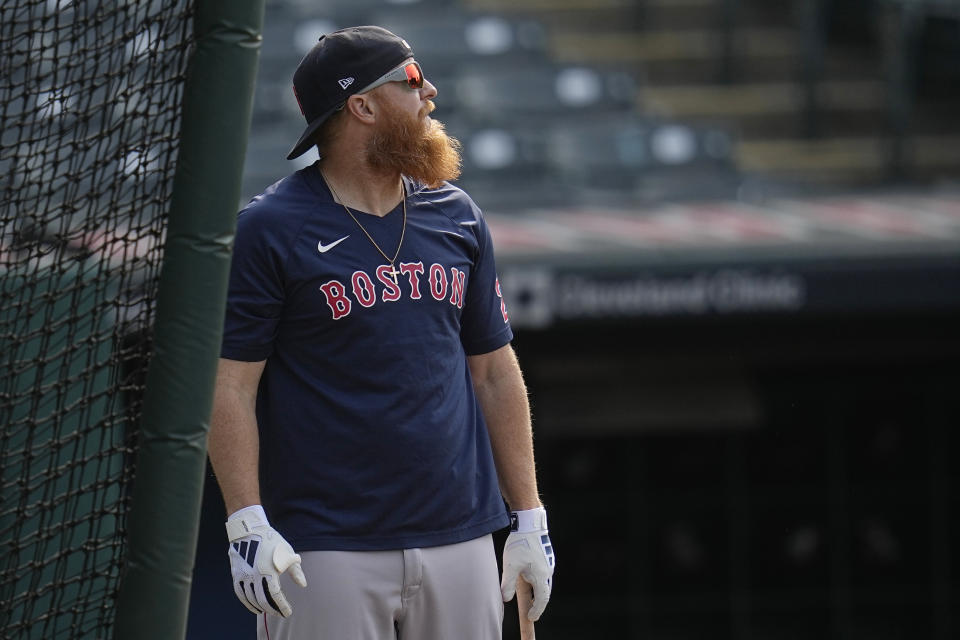 Boston Red Sox's Justin Turner watches a long fly ball during batting practice before a baseball game against the Cleveland Guardians, Tuesday, June 6, 2023, in Cleveland. (AP Photo/Sue Ogrocki)