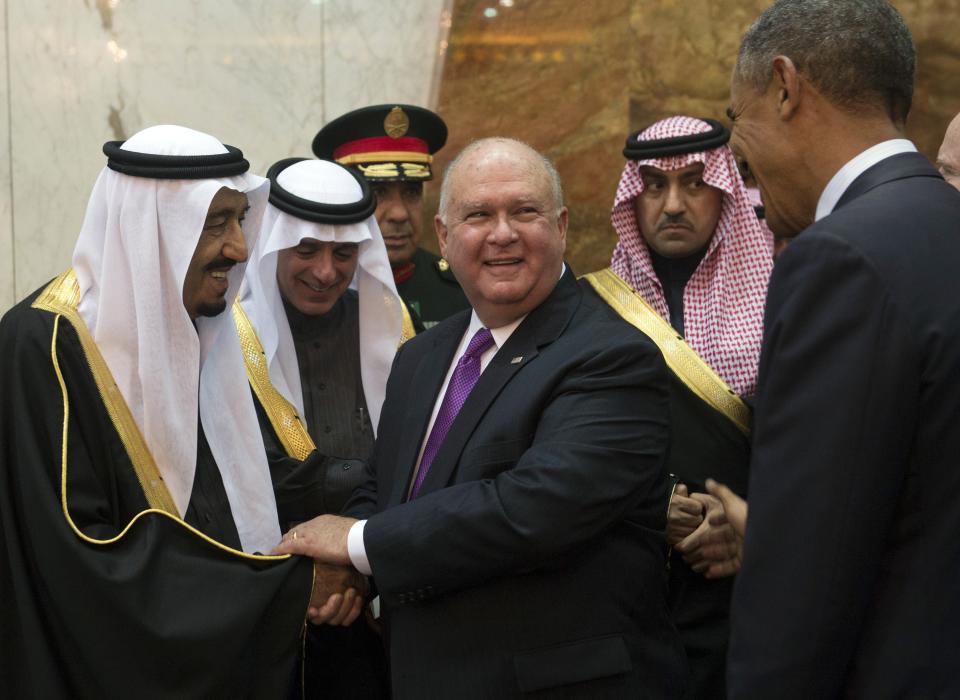 Saudi Arabia's newly appointed King Salman, left, shakes hands with the U.S ambassador to Saudi Arabia, Joseph Westphal, at a meeting with then-President Barack Obama, right, in Riyadh in 2015.