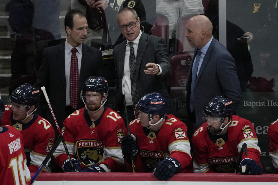 Florida Panthers head coach Paul Maurice, center, gestures during the third period of Game 4 of an NHL hockey Stanley Cup first-round playoff series against the Boston Bruins, Sunday, April 23, 2023, in Sunrise, Fla. The Bruins defeated the Panthers 6-2. (AP Photo/Marta Lavandier)