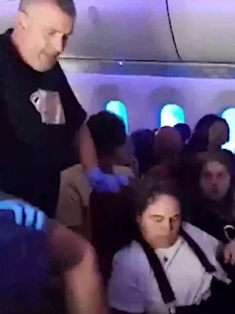 A passenger on a Latam Airlines flight to Auckland International Airport was thrown into the ceiling after the plane allegedly nose-dived for a couple of seconds. Video / Supplied ...