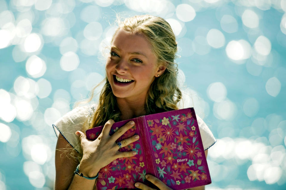 Amanda Seyfried holding a diary.