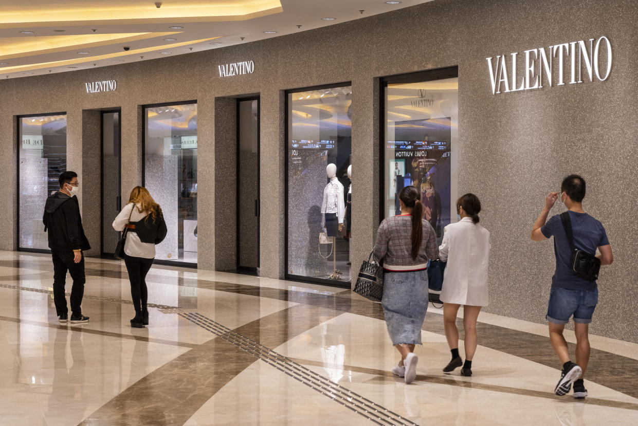 HONG KONG, CHINA - 2021/04/06: Shoppers walk past the Italian fashion clothing company Valentino store in Hong Kong. (Photo by Budrul Chukrut/SOPA Images/LightRocket via Getty Images)