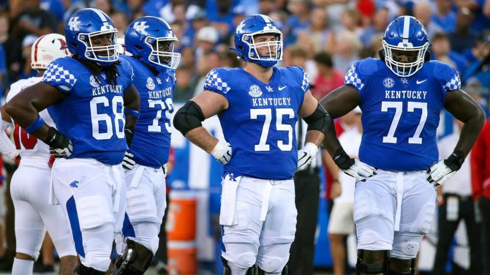 From left, Kentucky offensive linemen Kenneth Horsey (68), Tashawn Manning (79), Eli Cox (75) and Jeremy Flax (77) during a game last season. Manning is now a rookie with the NFL’s Baltimore Ravens. The other three linemen all will be back for the Wildcats this season.
