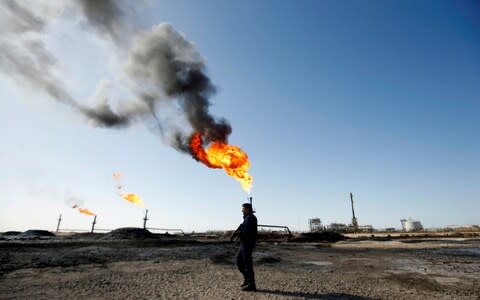  A policeman is seen at West Qurna-1 oilfield, which is operated by ExxonMobil, in Basra - Credit: REUTERS/Essam al-Sudani/File Photo