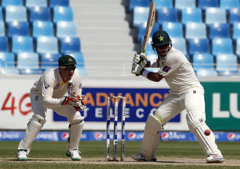 Pakistan's Misbah Ul-Haq (R) during the second day of the 1st Test against Australia on October 23, 2014 in Dubai