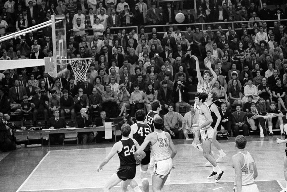 FILE - Louisiana State University's Pete Maravich (23) breaks the all-time scoring record with this shot against Mississippi in Baton Rouge, La., Jan. 31, 1970. Those who played with, followed or knew the late Maravich are conflicted about the seemingly inevitable moment — likely this Sunday — when he could be supplanted by Iowa women's basketball sensation Caitlin Clark atop the NCAA's all-time scoring list. (AP Photo/Jack Thornell, File)