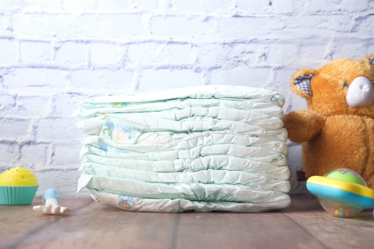 stack of baby diaper on table