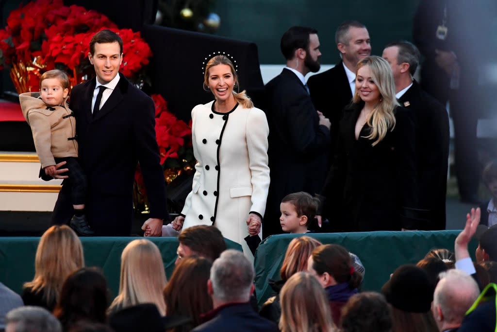 Ivanka Trump arrived to the tree lighting in a white coat with black trim, while Tiffany trailed behind in a black blazer-styled coat. (Photo by Katherine Frey/The Washington Post)