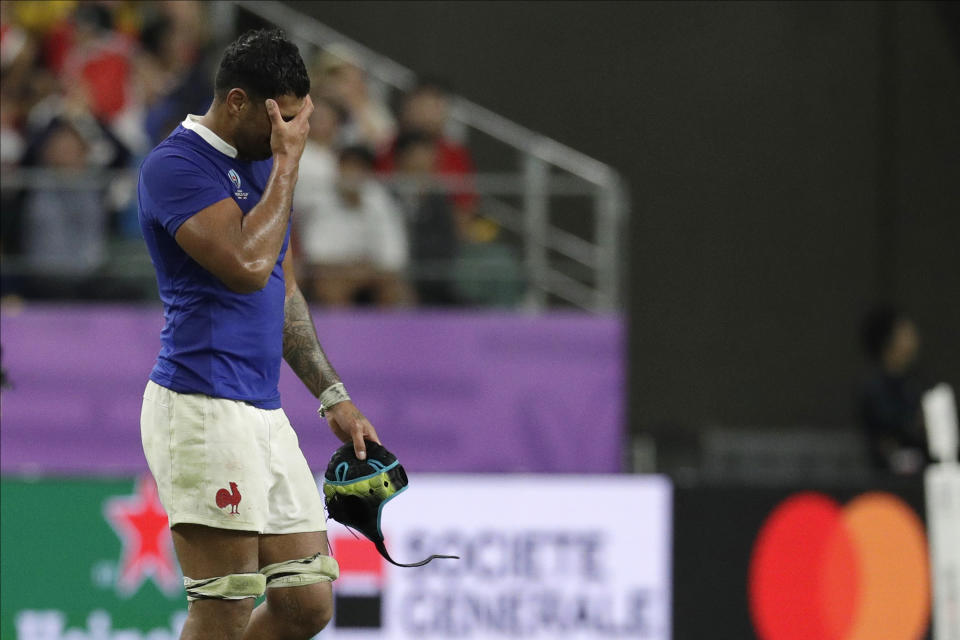 France's Sebastien Vahaamahina leaves the field after receiving a red card during the Rugby World Cup quarterfinal match at Oita Stadium between Wales and France in Oita, Japan, Sunday, Oct. 20, 2019. (AP Photo/Aaron Favila)