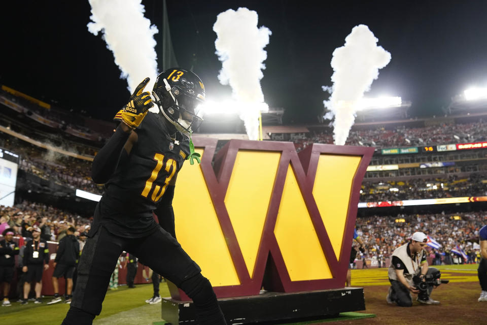 Washington Commanders cornerback Emmanuel Forbes (13) is introduced before the start of the first half of an NFL football game against the Chicago Bears, Thursday, Oct. 5, 2023, in Landover, Md. (AP Photo/Andrew Harnik)