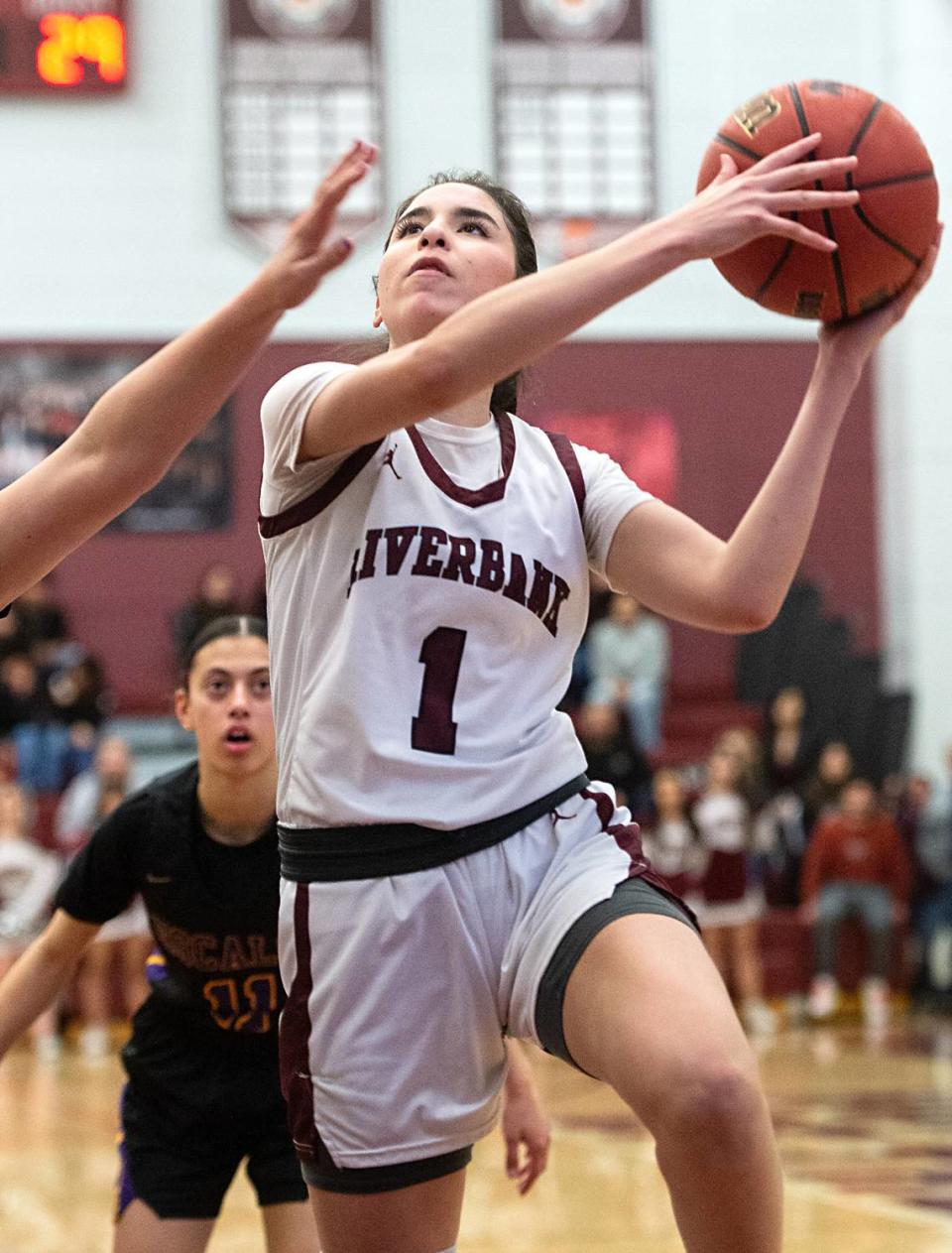 Riverbank’s Livi Fernandez drives to the hoop during the Sac-Joaquin section semifinal playoff game with Escalon in Riverbank, Calif., Tuesday, Feb. 21, 2023.