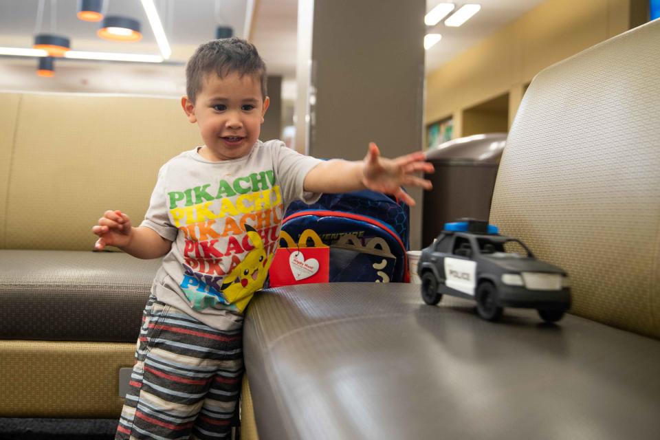 Savannah Chavarria's son, Landon, plays with his toy cars at Doña Ana Community College on Tuesday, May 3, 2022.