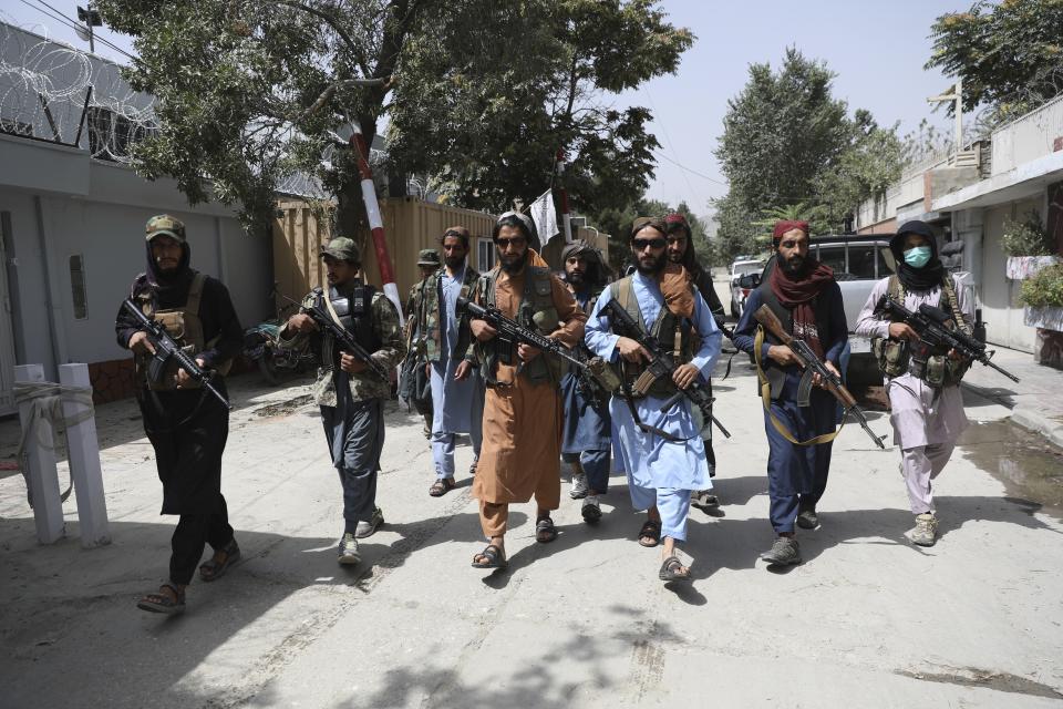 FILE - Taliban fighters patrol Wazir Akbar Khan neighborhood in Kabul, Afghanistan. Wednesday, Aug. 18, 2021. (AP Photo/Rahmat Gul, File)