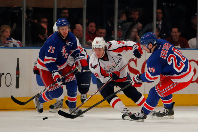   Alexander Semin #28 Of The Washington Capitals Attempts To Control The Puck Against Derek Stepan #21 And Chris Getty Images