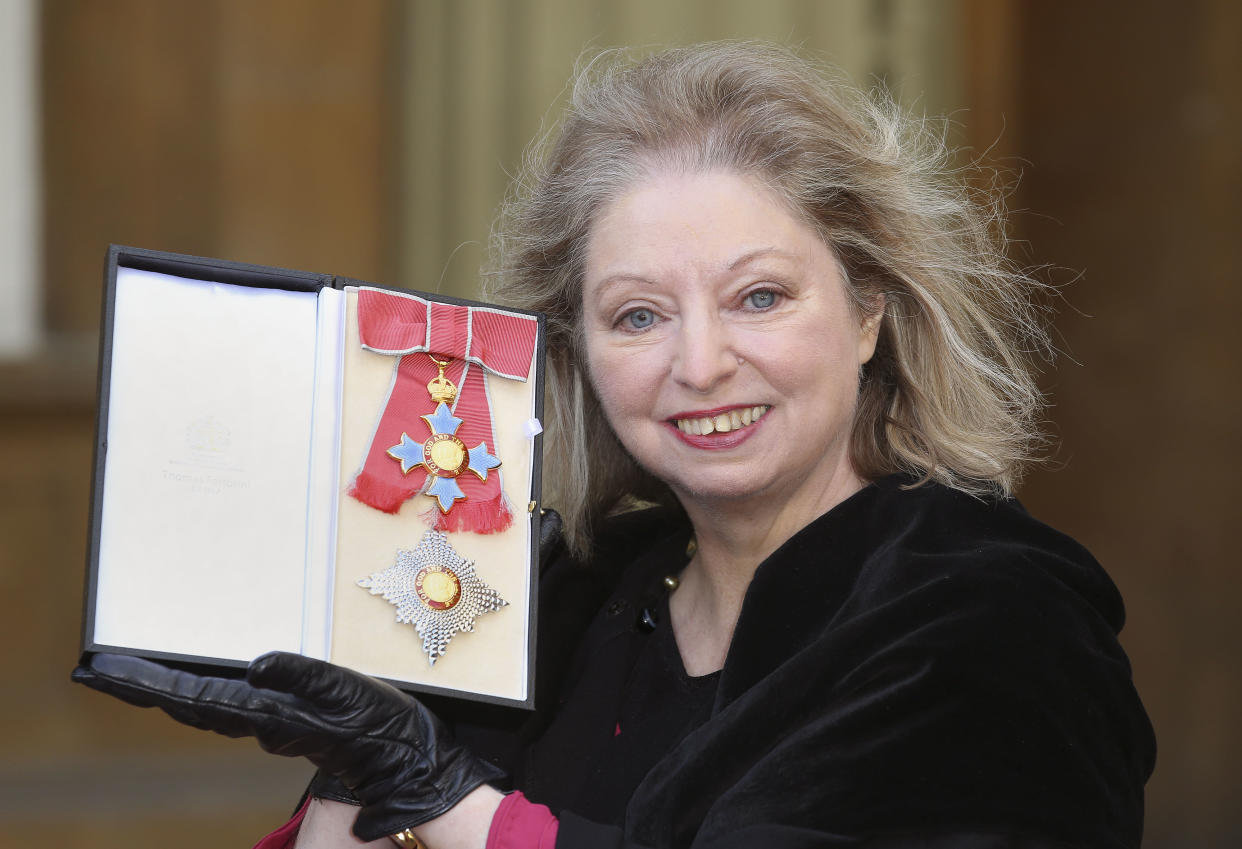 British author Hilary Mantel holds her Dame Commander of the Order of the British Empire (DBE) medal after it was presented to her by Britain's Prince Charles, Prince of Wales for services to literature at an Investiture ceremony at Buckingham Palace in London on February 6, 2015. AFP PHOTO / POOL / PHILIP TOSCANO (Photo by PHILIP TOSCANO / POOL / AFP) (Photo by PHILIP TOSCANO/POOL/AFP via Getty Images)