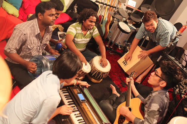 (From left) Osman, Getun and Jahangir practice with three of the Singaporean musicians during the first recording session for the music video. (Photo courtesy of Bernice Wong)