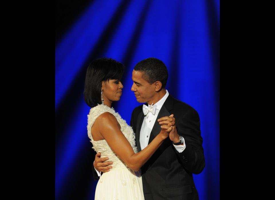 US President Barack Obama and his wife Michelle dance at the Neighborhood Ball January 20, 2009 in Washington, D.C., the first of ten inauguration balls. AFP PHOTO/Stan HONDA (Photo credit should read STAN HONDA/AFP/Getty Images)