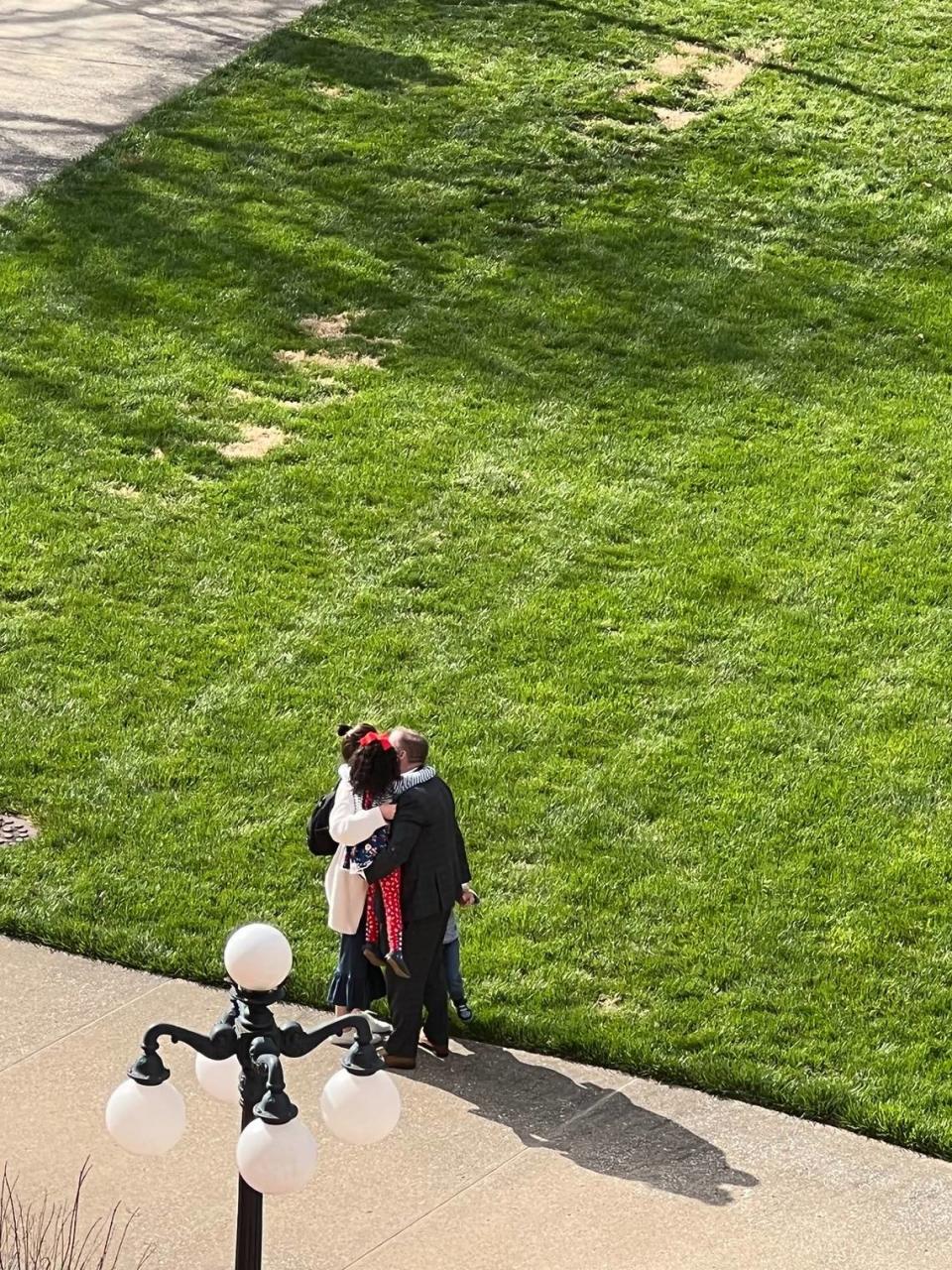 Sen. Whitney Westerfield hugs his family goodbye before they returned to Christian County. (Photo by David Yates)