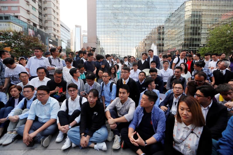 Pro-democratic winning candidates gather outside the campus of the Polytechnic University (PolyU) in Hong Kong