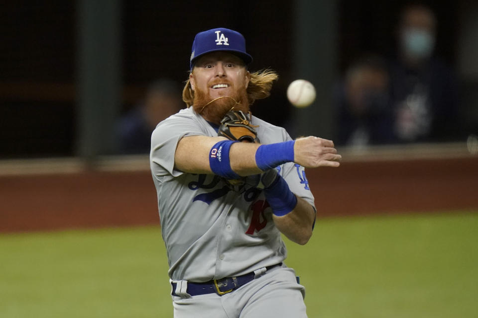 Los Angeles Dodgers third baseman Justin Turner throws out Atlanta Braves' Travis d'Arnaud out at first during the second inning in Game 4 of a baseball National League Championship Series Thursday, Oct. 15, 2020, in Arlington, Texas. (AP Photo/Eric Gay)