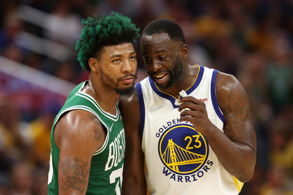 Golden State Warriors forward Draymond Green gives Boston Celtics guard Marcus Smart an earful during Game 2 of the NBA Finals. (Ezra Shaw/Getty Images)