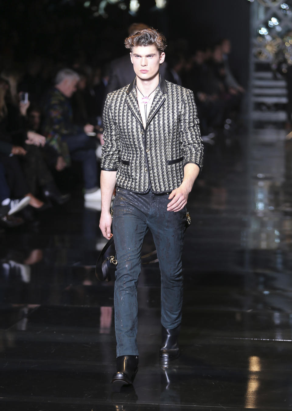 A model wears a creation for Versace men's Autumn-Winter 2014 collection, part of the Milan Fashion Week, unveiled in Milan, Italy, Saturday, Jan. 11, 2014. (AP Photo/Antonio Calanni)