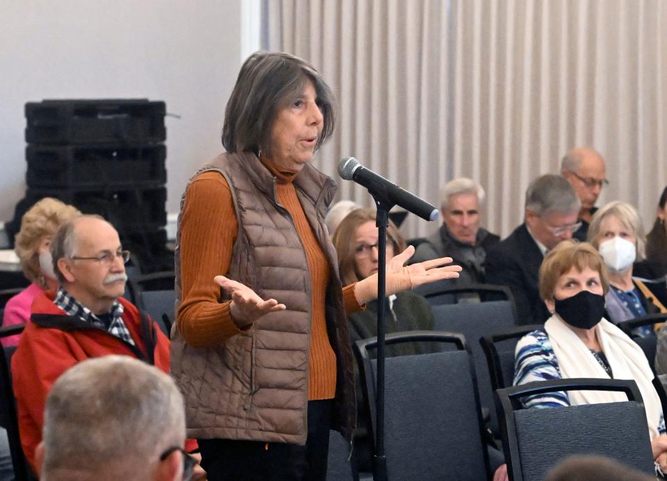 Henrietta Consentino of Plymouth questions the representatives of the NRC at the hearing Monday.