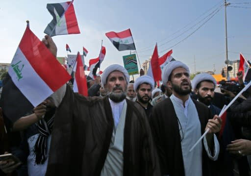 Iraqi Shiite Muslim clerics, supporters of the Hashed al-Shaabi armed network, demonstrate in Baghdad