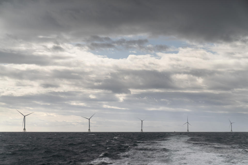 FILE - The five turbines of America's first offshore wind farm, owned by the Danish company, Orsted, are seen from a tour boat off the coast of Block Island, R.I., Oct. 17, 2022. The federal government has finalized two areas for floating offshore wind farms along the Oregon coast. The Bureau of Ocean Energy Management says the two areas cover nearly 200,000 acres. (AP Photo/David Goldman, File)