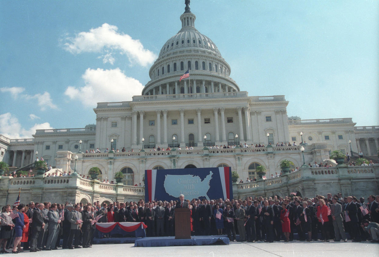 House Republican leader Newt Gingrich opens a ceremony in front of Capitol Hill September 27,1994. Some 300 Republican incumbents and challengers signed a binding contract with American people, which contains a 10-point reform program which a Republican majority would seek to enact in the first 100 days of the 104th Congress.     REUTERS /Ira Schwarz