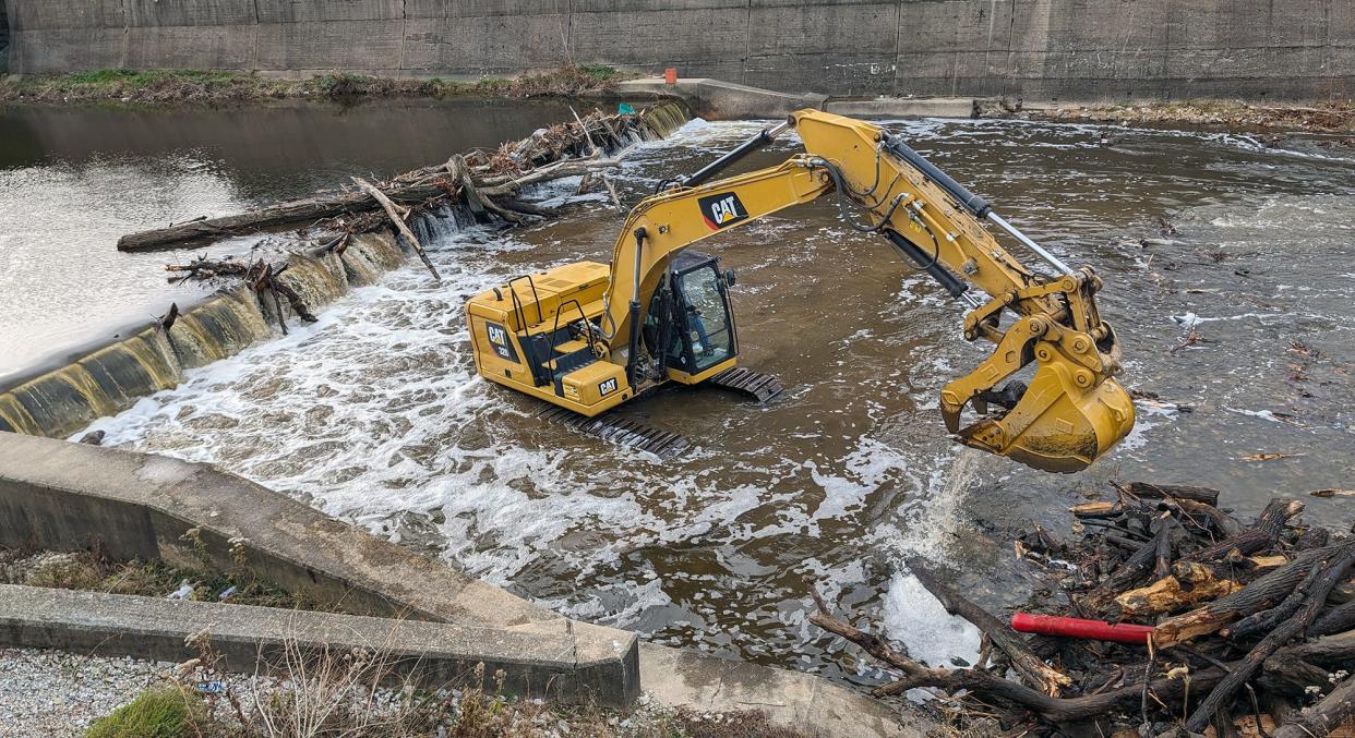 Debris is cleared from the Bascule Gate Dam, installed in 1983, located downstream of the Philadelphia Street bridge in York on December 4, 2023 in preparation for demolition.