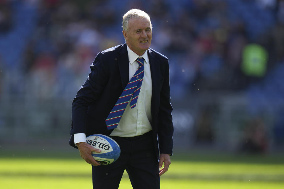 FILE - Italy head coach Kieran Crowley holds a ball during the warm-up before the Six Nations rugby union international match between Italy and Wales in Rome, Italy, Saturday, March 11, 2023. Italy was at one of its lowest points when Kieran Crowley took charge in May 2021. He figured it was pointless Italy play the same way with the same players. So the former New Zealand fullback expanded the game plan and brought in younger players. (AP Photo/Alessandra Tarantino, File)