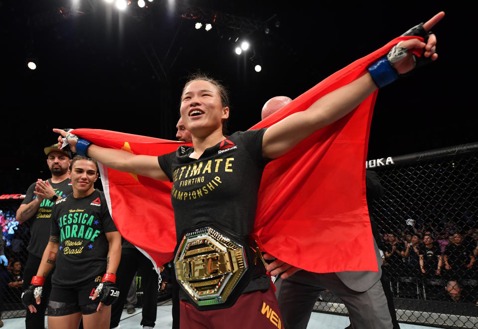 SHENZHEN, CHINA - AUGUST 31:  Zhang Weili of China celebrates after her knockout victory over Jessica Andrade of Brazil in their UFC strawweight championship bout during the UFC Fight Night event at Shenzhen Universiade Sports Centre on August 31, 2019 in Shenzhen, China. (Photo by Brandon Magnus/Zuffa LLC/Zuffa LLC)