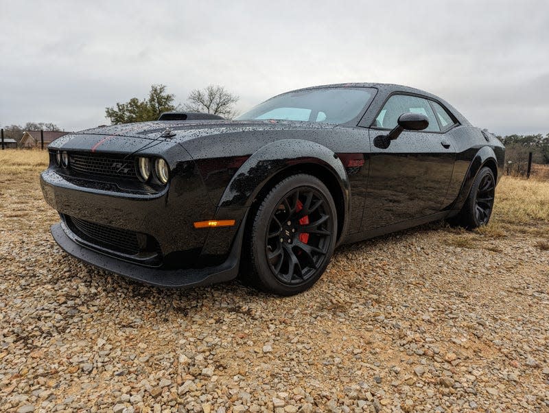 Front 3/4 view of a black Dodge Challenger