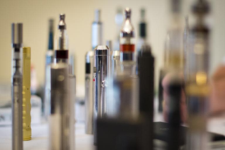 A selection of "Nicotine Containing Products", or "NCP"s are displayed during "The E-Cigarette Summit" at the Royal Academy in central London on November 12, 2013