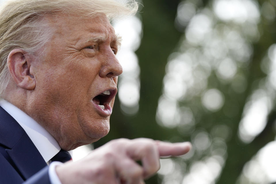 President Donald Trump speaks with reporters as he walks to Marine One on the South Lawn of the White House, Tuesday, Sept. 15, 2020, in Washington. Trump is en route to Philadelphia. (AP Photo/Alex Brandon)