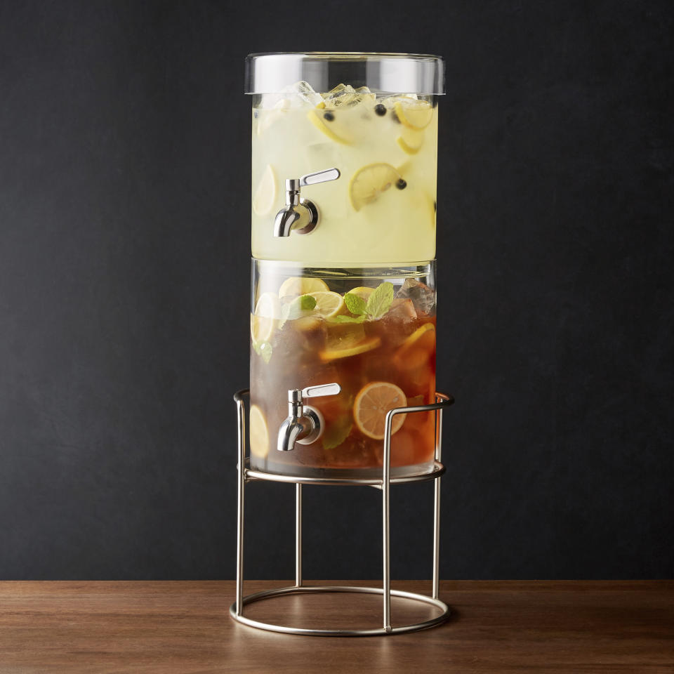 This photo provided by Crate & Barrel shows a stacking drink dispenser with a silver stand. An item like this available at Crate & Barrel can lend a hand in entertaining in a small space. With a little planning, even the smallest homes can be just right for holiday entertaining. (Crate & Barrel via AP)