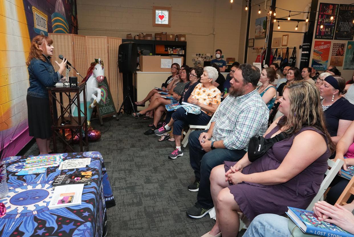 Meg Shaffer, a USA Today bestsellng author, talks about her second novel The Lost Story during a release party and book reading at the Carmichael's Bookstore in Louisville, Ky. on July 16, 2024. Shaffer lives in Kentucky.