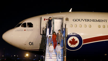 Canadian Prime Minister Justin Trudeau, his wife Sophie Gregoire Trudeau, their daughter Ella Grace, and sons Hadrien and Xavier disembark from an airplane upon their arrival at Air Force Station Palam in New Delhi, India February 17, 2018. REUTERS/Adnan Abidi